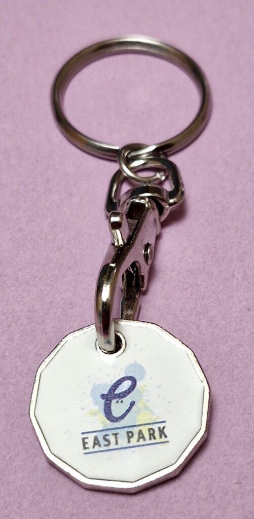 Image showing a trolley token with the logo of East Park in Glasgow attached to its key ring.
